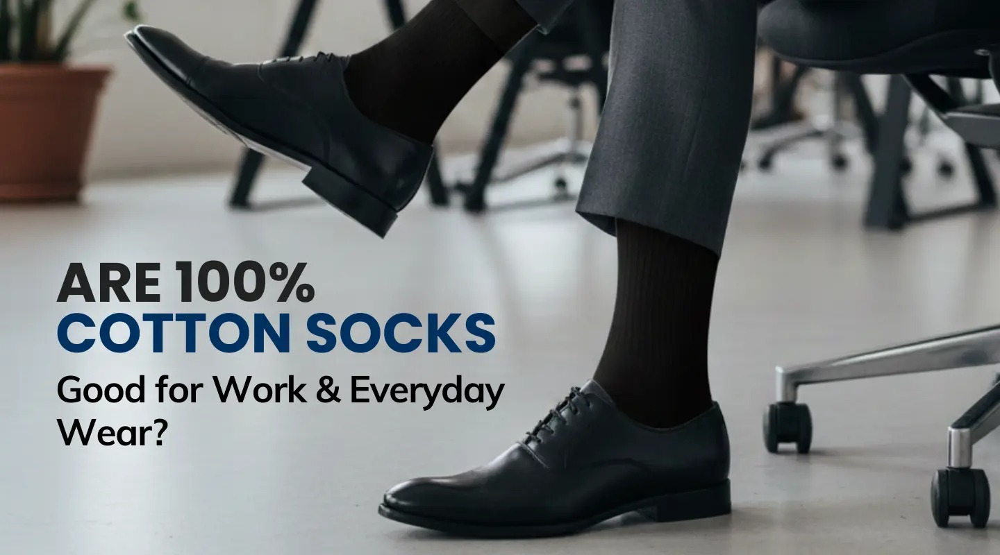 Man wearing black dress shoes and 100% cotton socks in an office, banner text: are 100% cotton socks good for work and everyday wear.